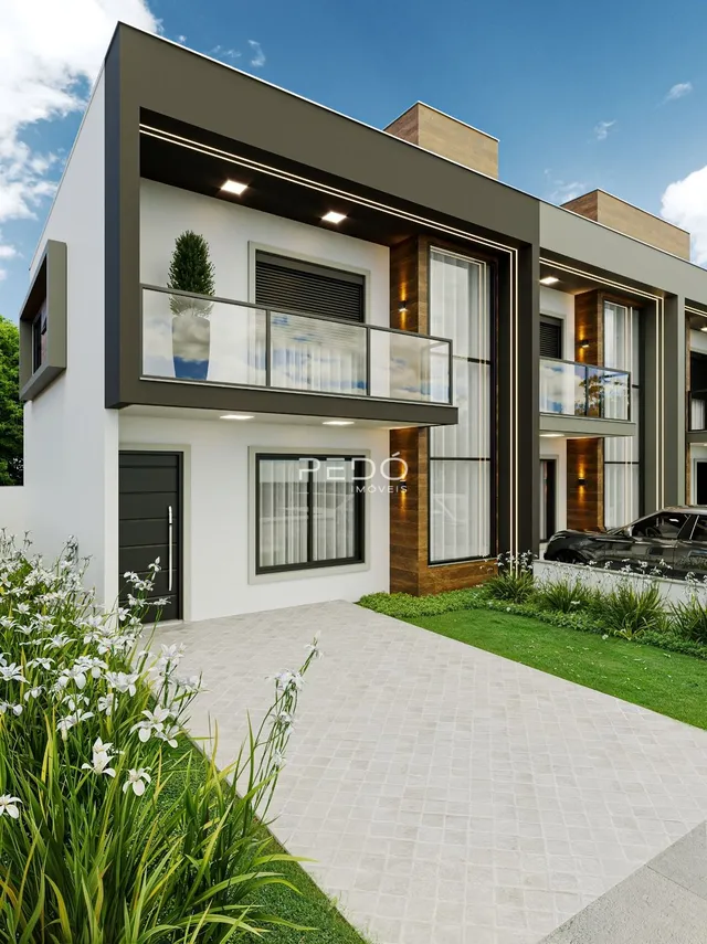 Fachada moderna de uma casa em Lajeado, Brasil com área de jardim e pátio.
