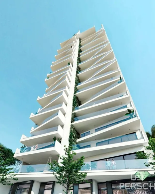 Vista da fachada de um prédio de apartamentos moderno em Lajeado com varandas.