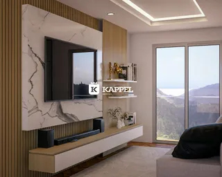 Uma sala de estar moderna com televisão e vista para a paisagem.