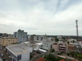 Vista aérea de um bairro residencial em Lajeado, Brasil, mostrando edifícios urbanos.