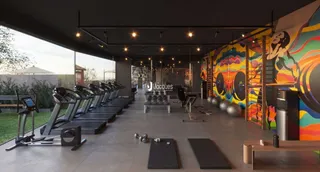 Imagem de uma área de ginástica interna com esteiras e equipamentos de treino.