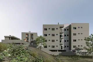 Vista externa de um complexo residencial em Lajeado, Brasil, mostrando edifícios em um terreno inclinado.