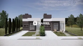Fachada moderna de uma casa em Lajeado, Brasil, com jardim frontal e calçada.