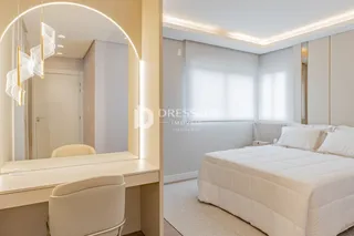 Quarto com cama de casal e decoração moderna em apartamento.