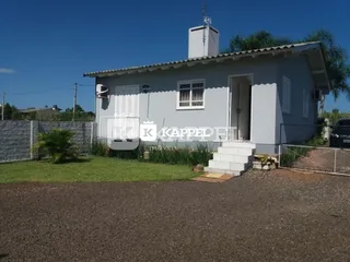 Fachada de uma casa simples em Lajeado, Brasil, sob luz do dia.