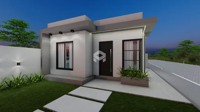 Fachada de uma residência moderna com jardim em Lajeado.