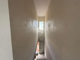 Corredor interno de um imóvel em Lajeado, Brasil.