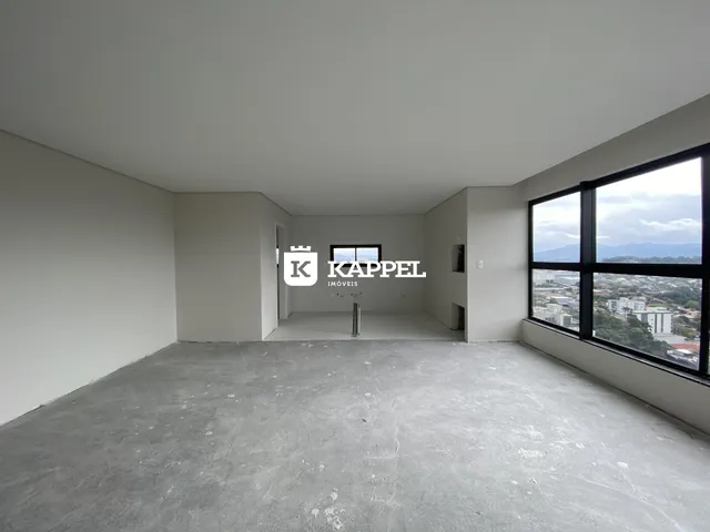 Foto de um ambiente interno vazio com piso de concreto em um imóvel em Lajeado.