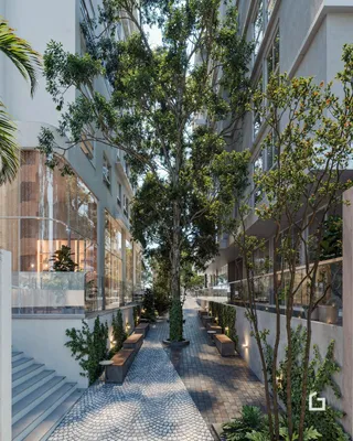 Vista de um pátio externo com árvores e um caminho pavimentado em um complexo residencial.