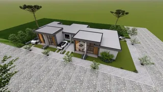 Fachada de uma residência em Lajeado, Brasil, com jardim e área pavimentada.