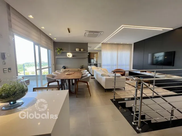 Sala de estar moderna com vista para a paisagem externa.