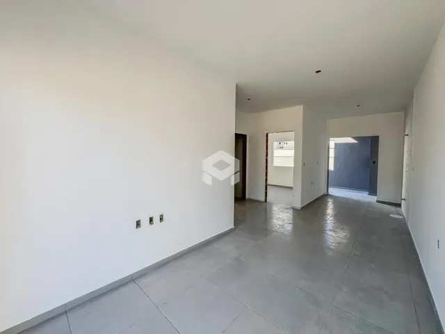 Hall de entrada de uma área comum de uma residência.
