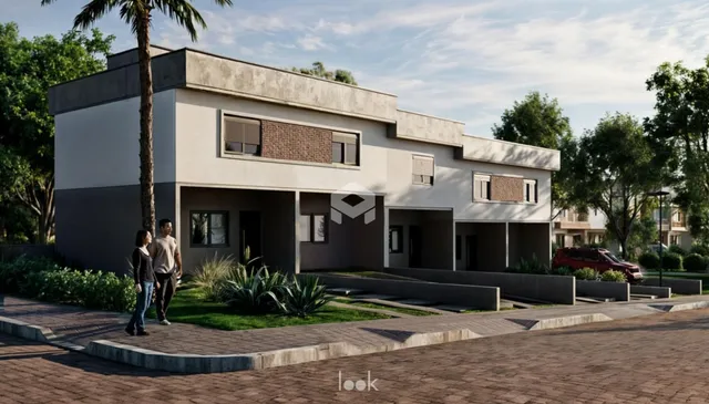 Fachada de uma residência moderna em Lajeado, Brasil, com paisagismo frontal.