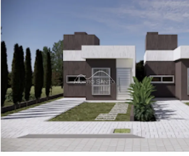 Fachada de uma casa moderna com revestimento escuro e detalhes brancos em Lajeado, Brasil.