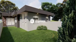 Foto da fachada de uma casa moderna com jardim em Lajeado, Brasil.