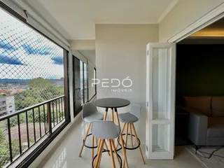 Vista de uma sala com varanda e grade de segurança em Lajeado, Brasil.