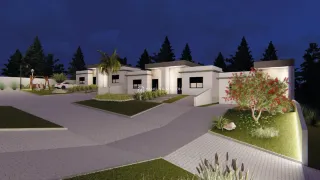 Fachada de uma casa moderna com paisagismo em Lajeado, Brasil, vista à noite.