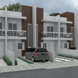 Fachada de um prédio residencial em Lajeado, Brasil, com detalhes em tijolo aparente e varandas brancas.