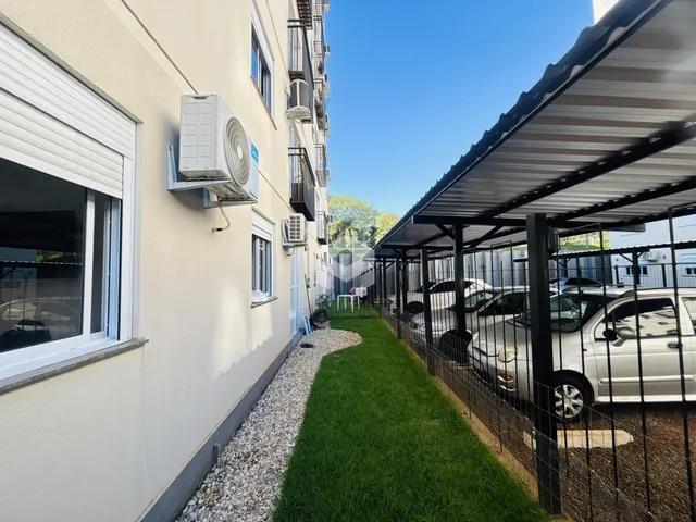 Foto da fachada de um imóvel em Lajeado, Brasil, com área externa gramada.