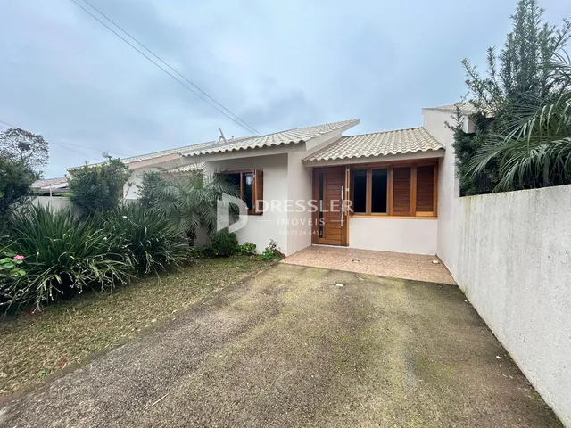Fachada de uma casa em Lajeado, Brasil, com jardim frontal.
