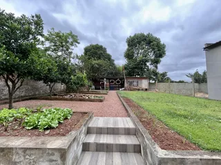 Vista externa do jardim e acesso da propriedade em Lajeado.