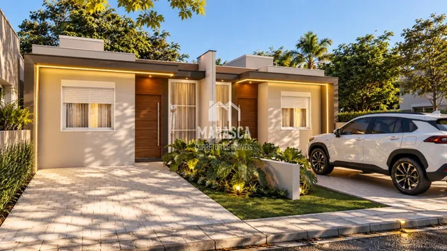Fachada de uma casa moderna em Lajeado, Brasil com jardim e entrada pavimentada.