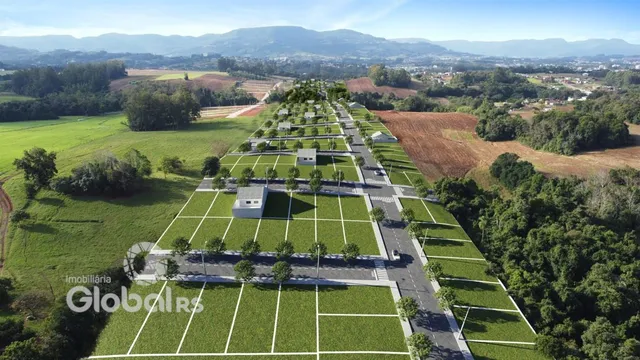 Vista aérea de um loteamento residencial com áreas verdes em Lajeado, Brasil.