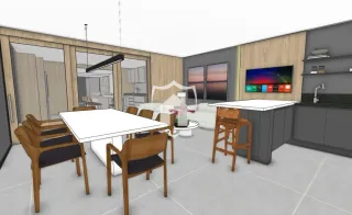 Uma sala de jantar com mesa e cadeiras em um imóvel.