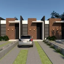 Fachada externa de uma residência em Lajeado, Brasil, com revestimento de tijolos aparentes.