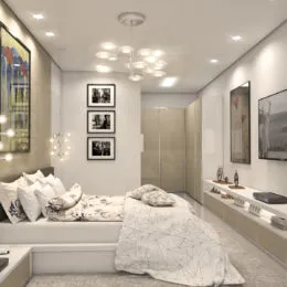 Quarto com cama e iluminação clara em um ambiente interno.