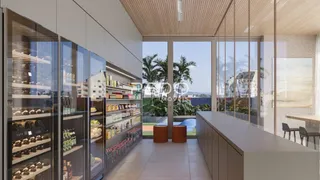 Vista da cozinha moderna com armários embutidos e divisórias de vidro.