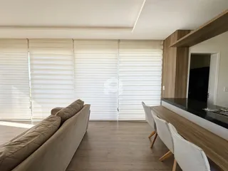Foto da sala de estar e jantar de um imóvel em Lajeado.