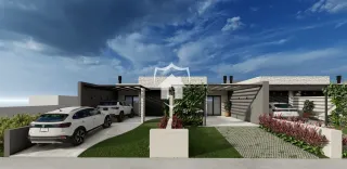 Fachada de uma casa moderna em Lajeado, Brasil com jardim e entrada.