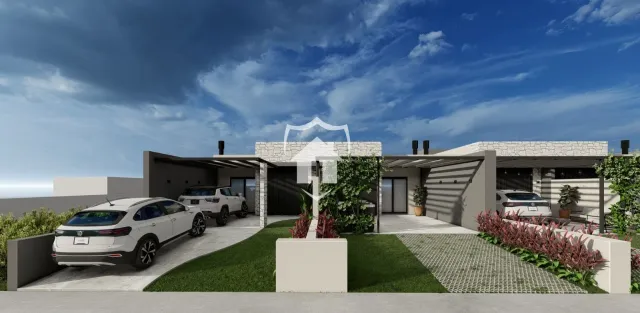 Fachada de uma casa moderna em Lajeado, Brasil com jardim e entrada.
