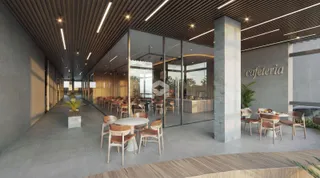 Interior de um espaço comercial com corredor e área de refeição em Lajeado.