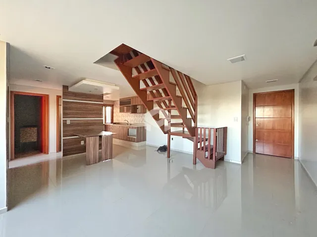 Sala de estar e cozinha de uma residência moderna em Lajeado.