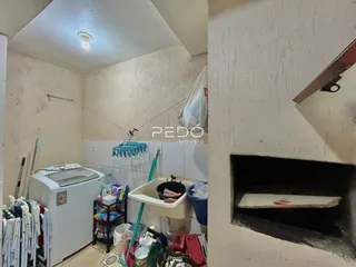 Foto de um ambiente interno mostrando uma máquina de lavar e uma pia.