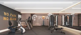 Foto de um espaço interno de academia com equipamentos de musculação.