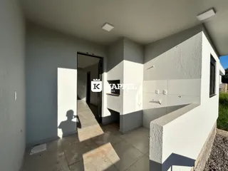 Foto do corredor de entrada de uma residência em Lajeado, Brasil.