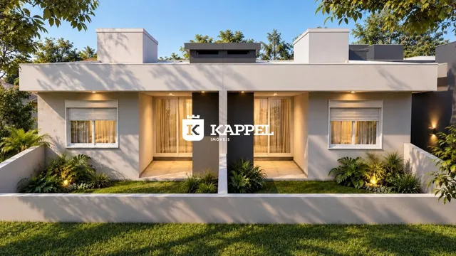 Fachada moderna de uma casa em Lajeado, Brasil, com jardim bem cuidado.
