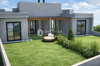 Fachada de uma casa moderna com jardim gramado.