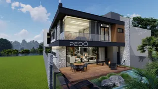Fachada moderna de uma residência em Lajeado, Brasil, com área externa e deck.