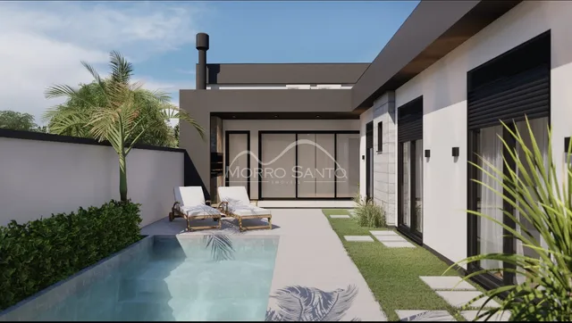 Fachada de uma casa moderna com piscina e paisagismo em Lajeado.