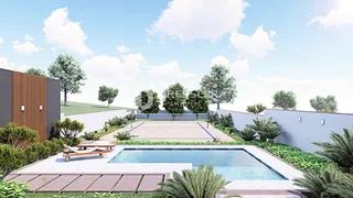 Vista externa de uma piscina e jardim em uma propriedade em Lajeado.