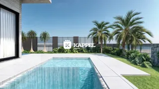 Piscina externa com deck e paisagismo em Lajeado.