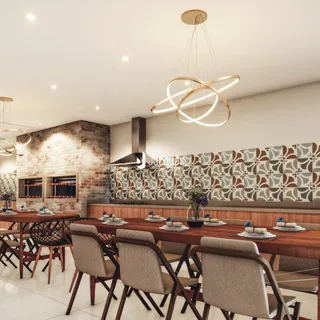 Foto de uma sala de jantar com paredes de tijolo aparente e móveis de madeira.