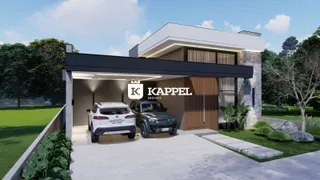 Fachada moderna de uma residência com garagem e paisagismo em Lajeado.