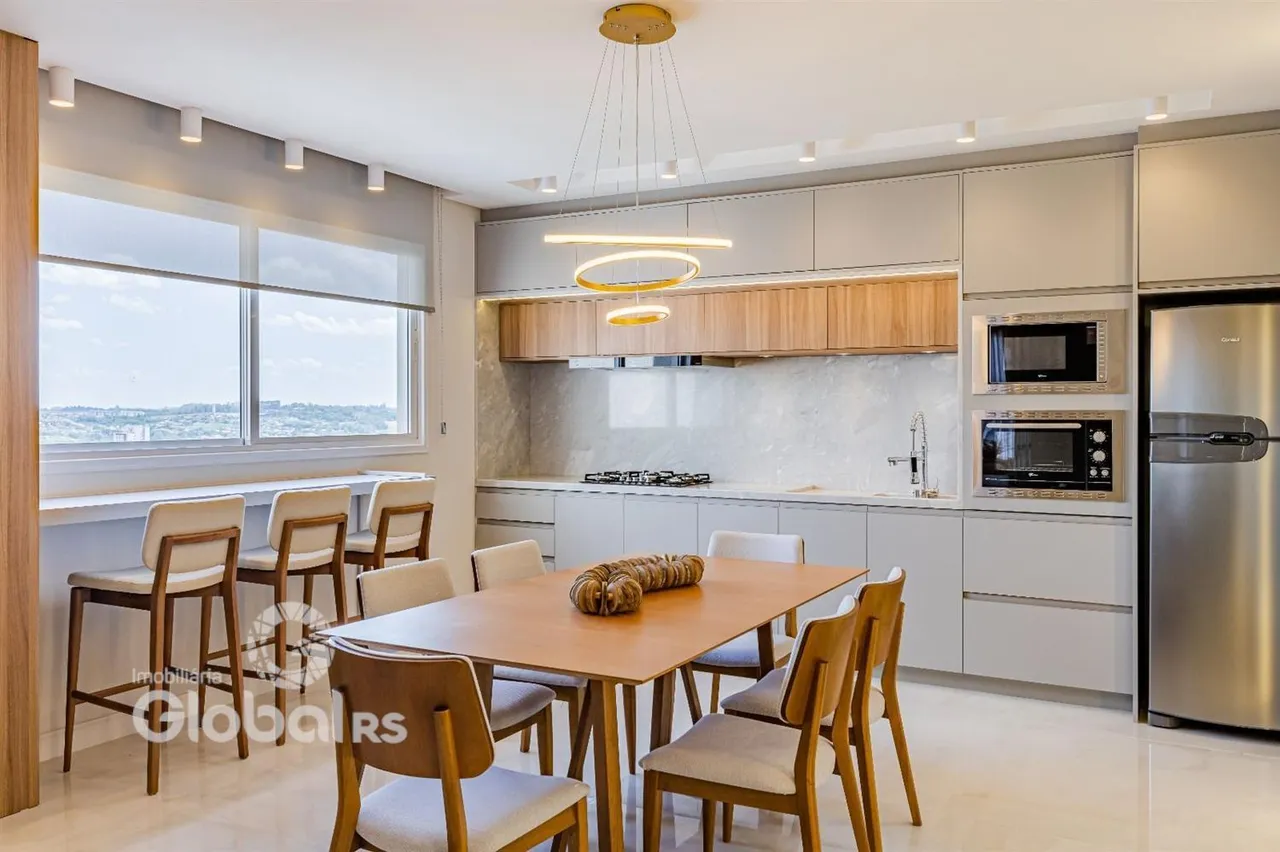 Sala de jantar e cozinha moderna com vista para a paisagem.