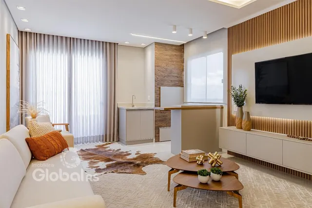 Sala de estar moderna com luz natural e decoração aconchegante.