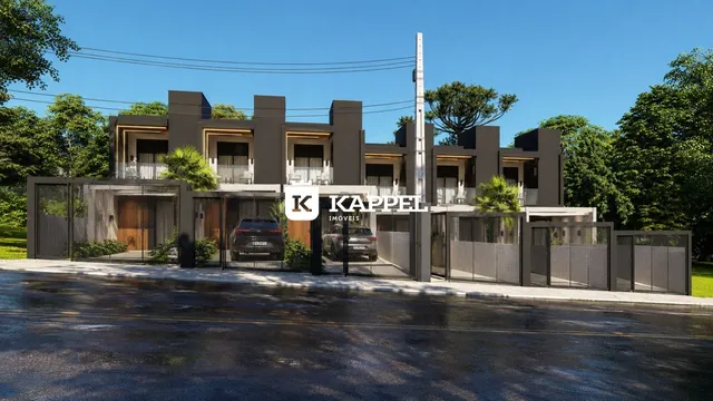 Fachada moderna de um conjunto residencial em Lajeado, Brasil, com arquitetura escura e detalhes em madeira.